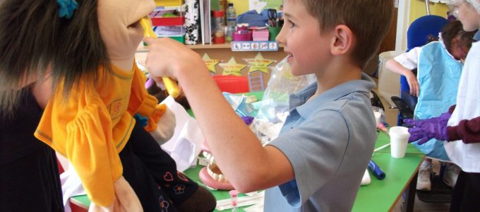 Child playing with dentist playbox